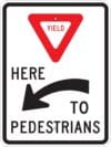 R1 5al yield here to pedestrians left sign